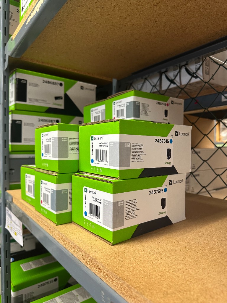 Lexmark toner cartridges stocked on warehouse shelves at Automation One